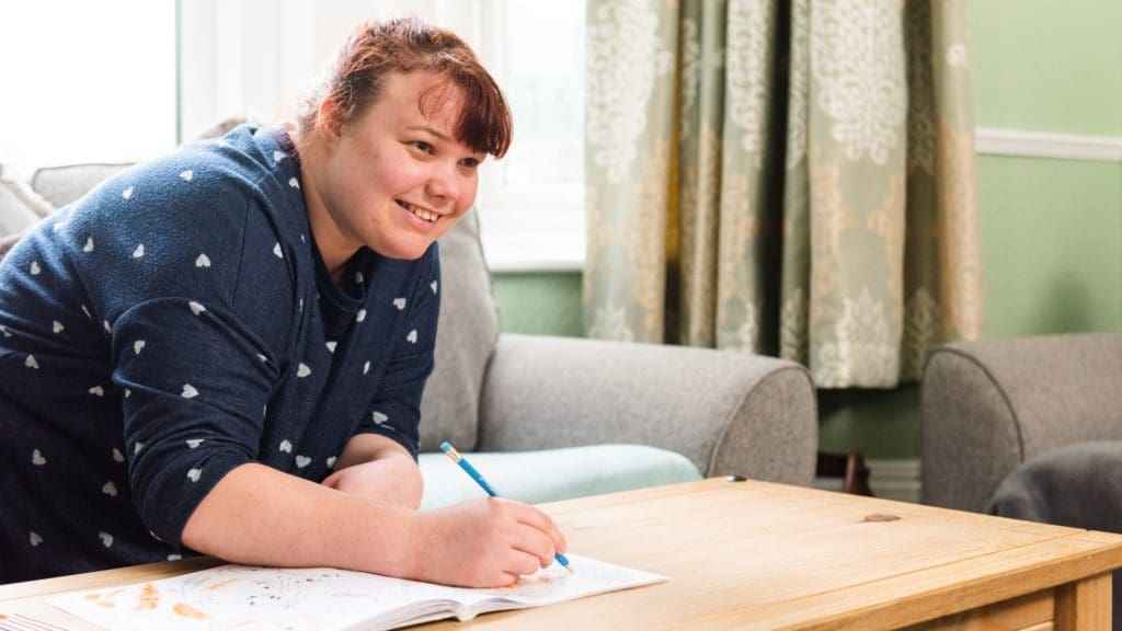Lifeworks-residential-person-colouring-on-table